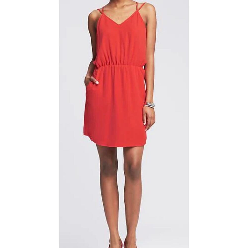 Banana Republic sleeveless dress in a vibrant orange features a high neckline